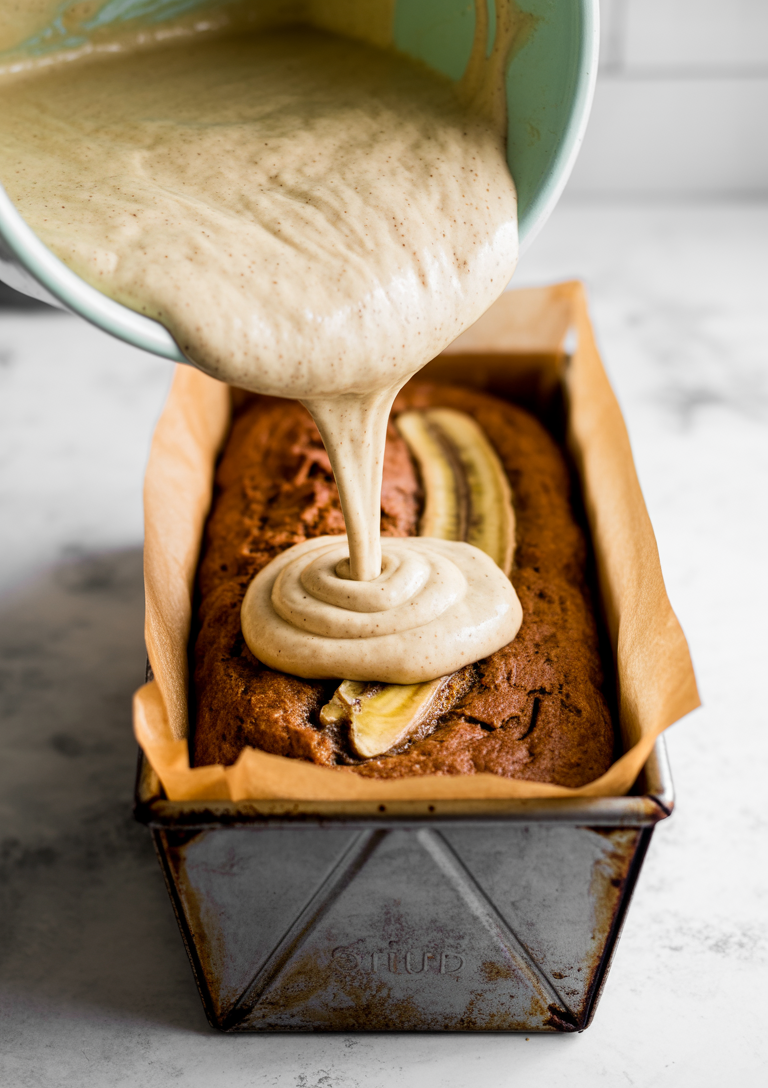 Loaf pan lined with parchment paper for easy bread removal